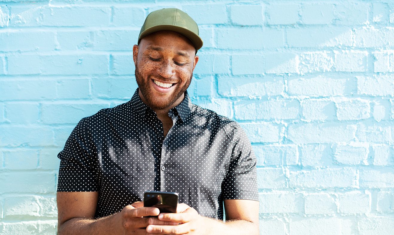 Man smiling with smart phone