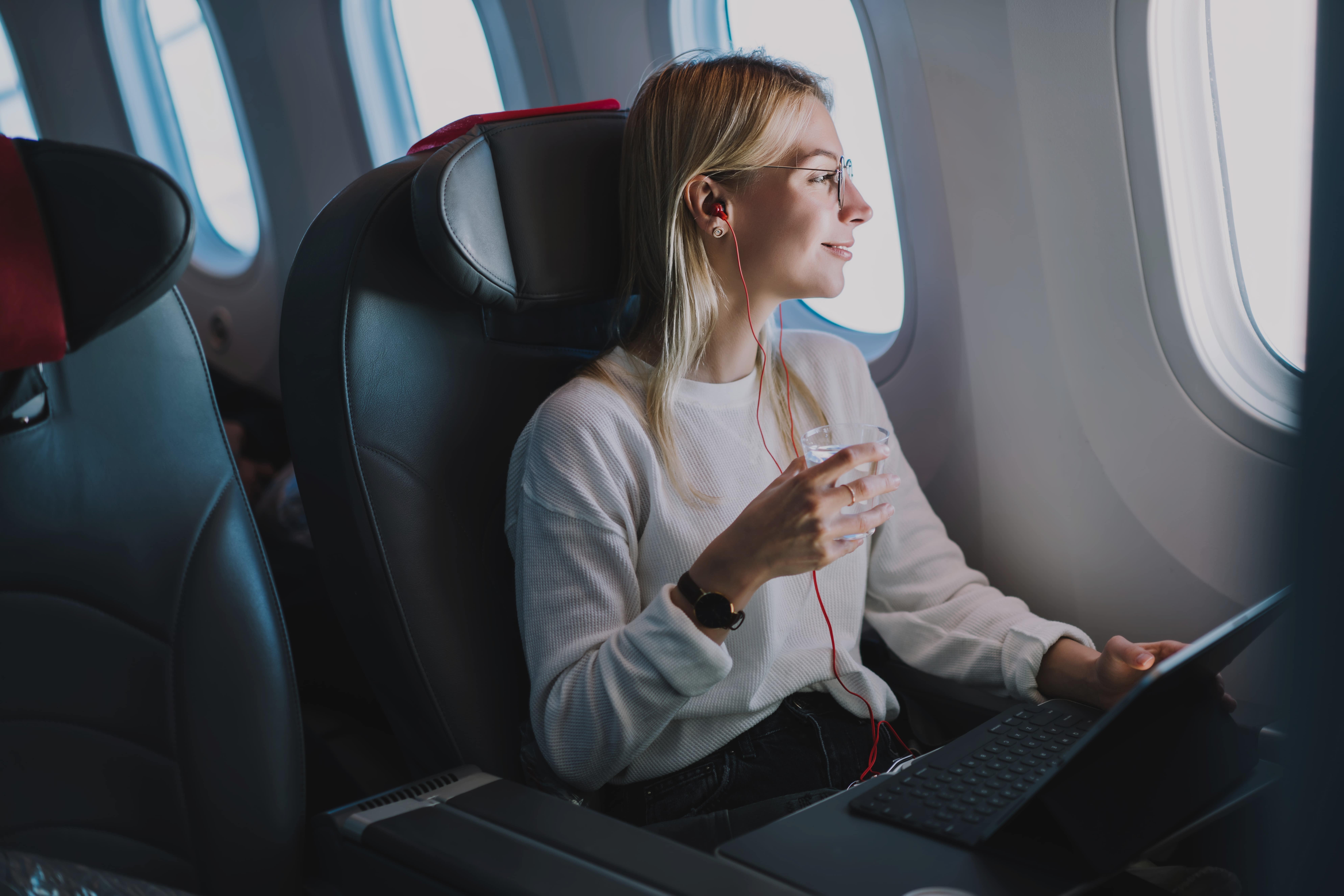 Professional woman using laptop during the flight